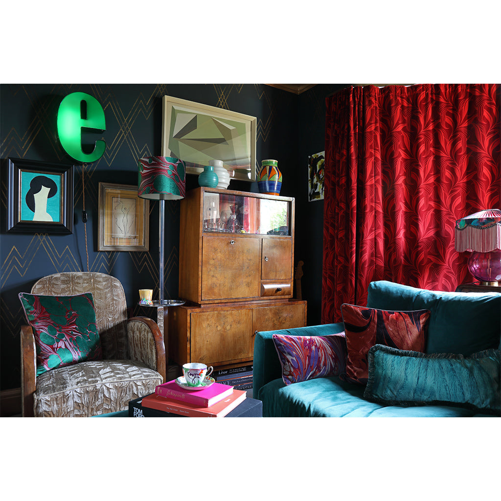 Velvet cushions on velvet sofa in a living room