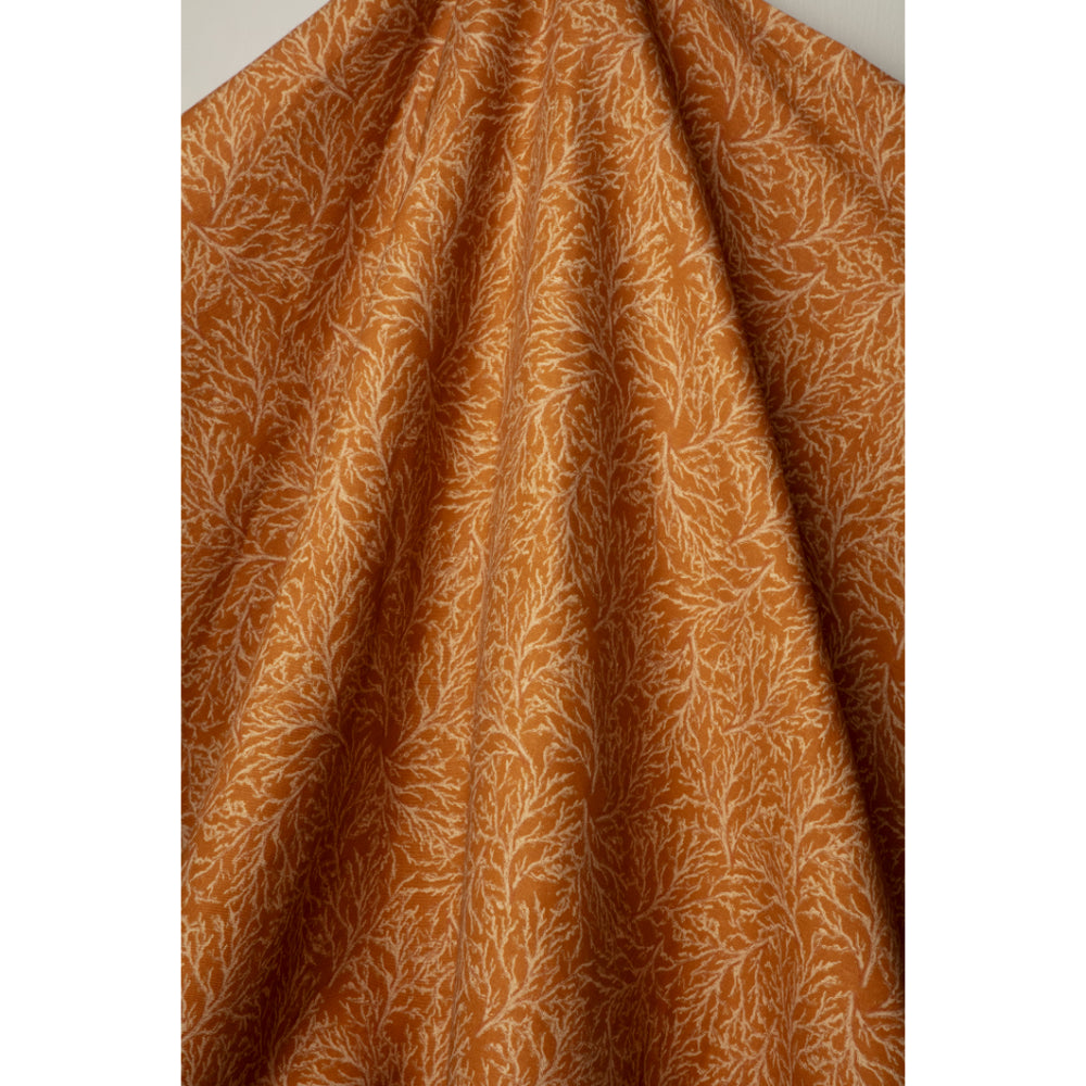 Coral pattern fabric in orange and cream tones