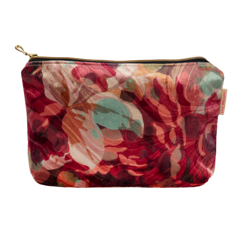 Floral patterned pouch with a gold zipper on a white background