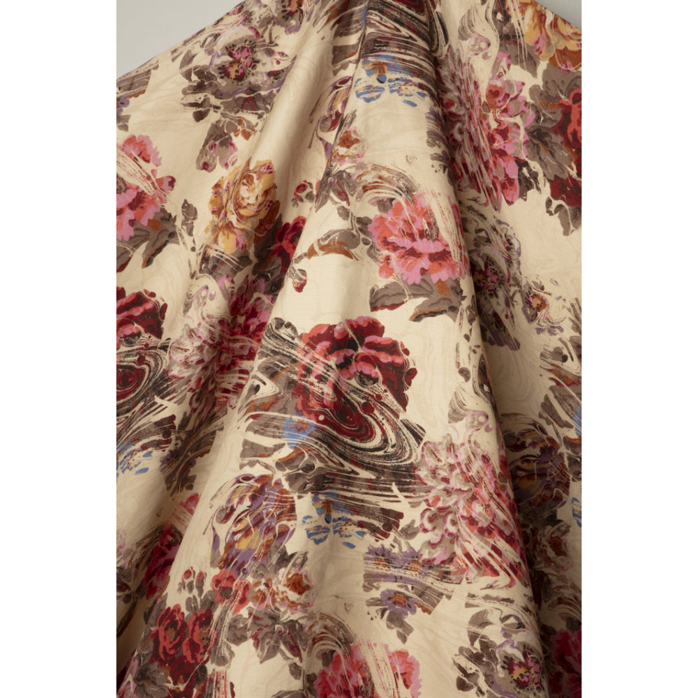 Floral patterned fabric with pink and purple flowers on a beige marbled background