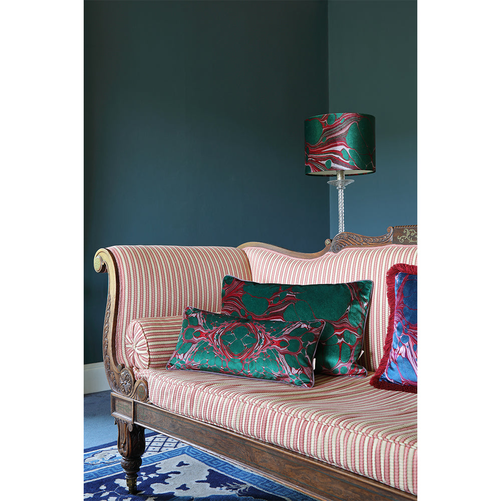 Velvet lampshade with matching cushions on sofa
