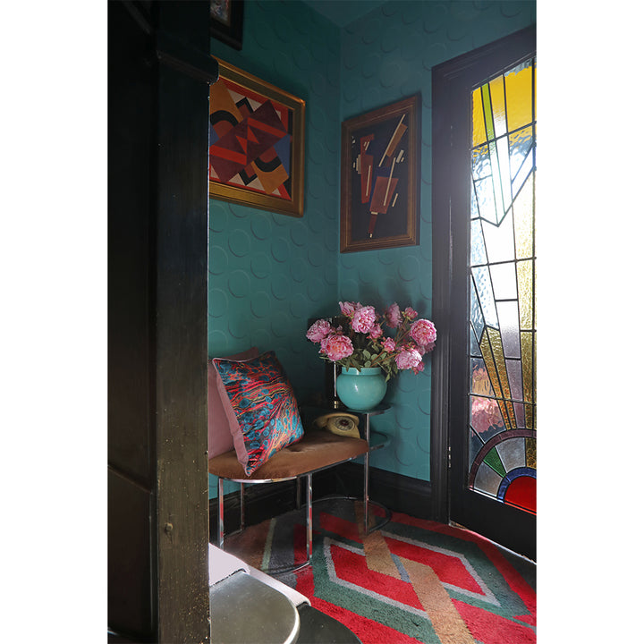 Velvet marbled cushion on stool in hallway