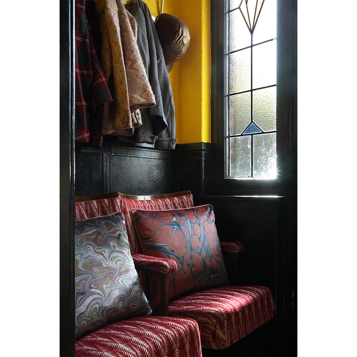 Velvet cushions on chairs in hallway