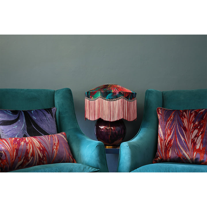 Velvet patterned cushions on velvet chairs