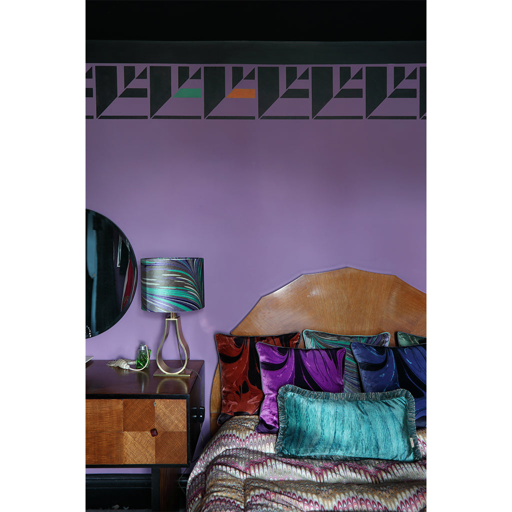 Velvet lampshade on bedroom bedside cabinet 