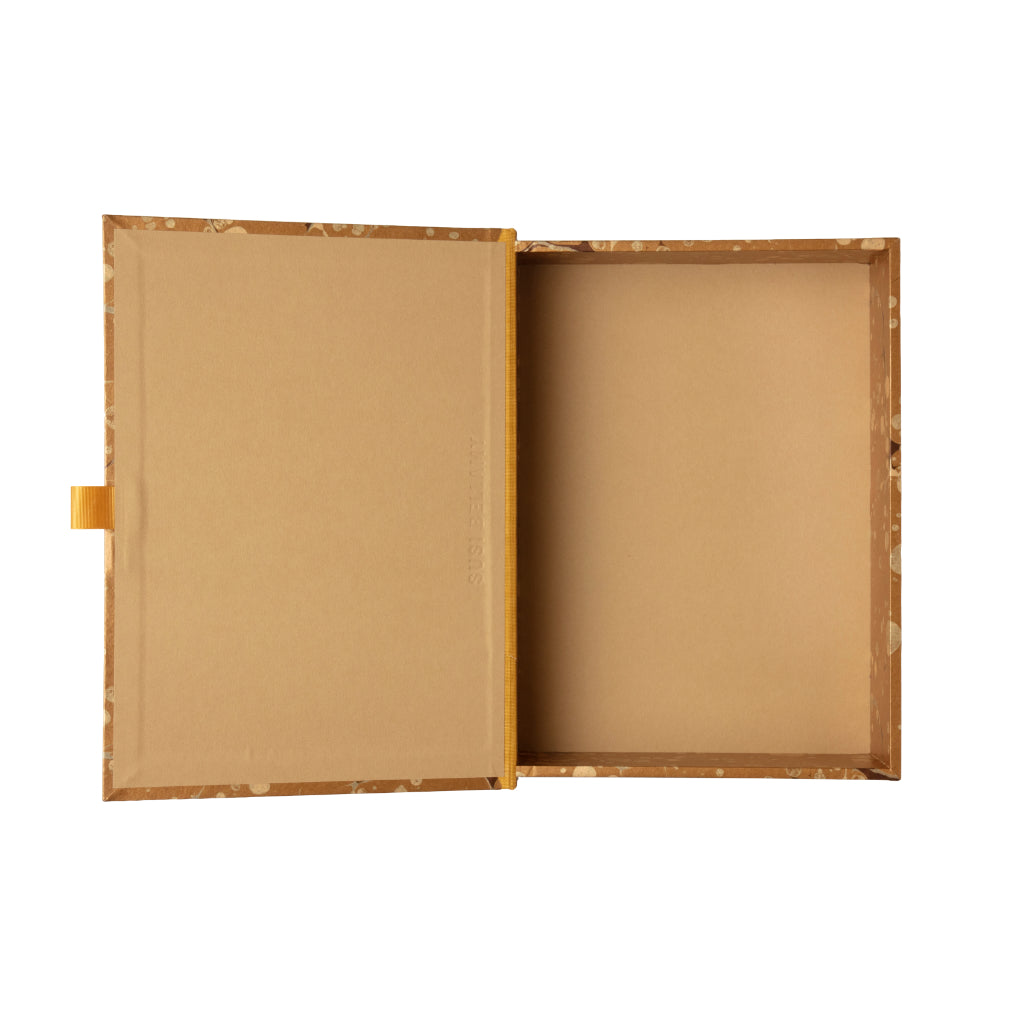 Gold, beige and brown patterned box file on a white background