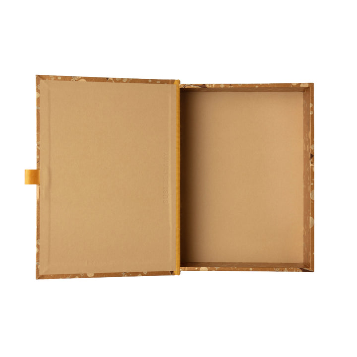 Gold, beige and brown patterned box file on a white background