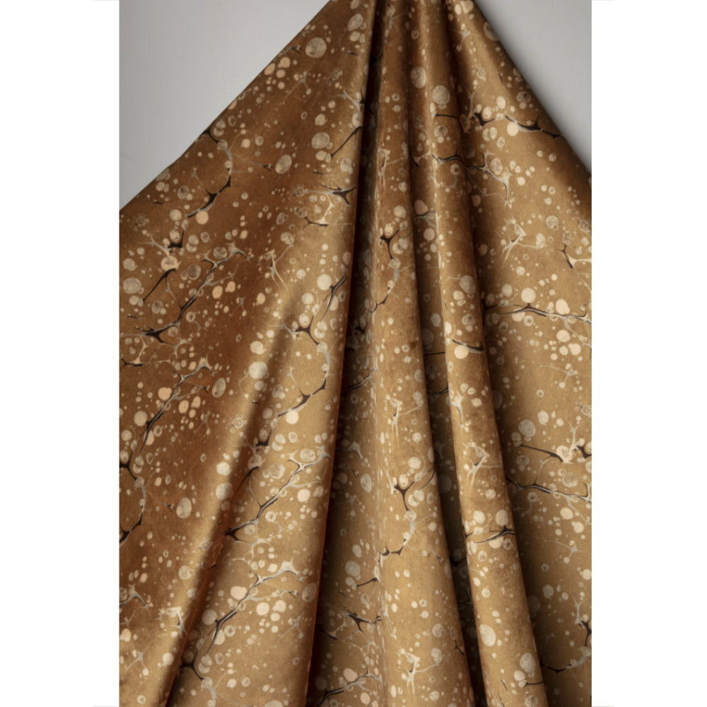 Gold and brown marbled patterned fabric 