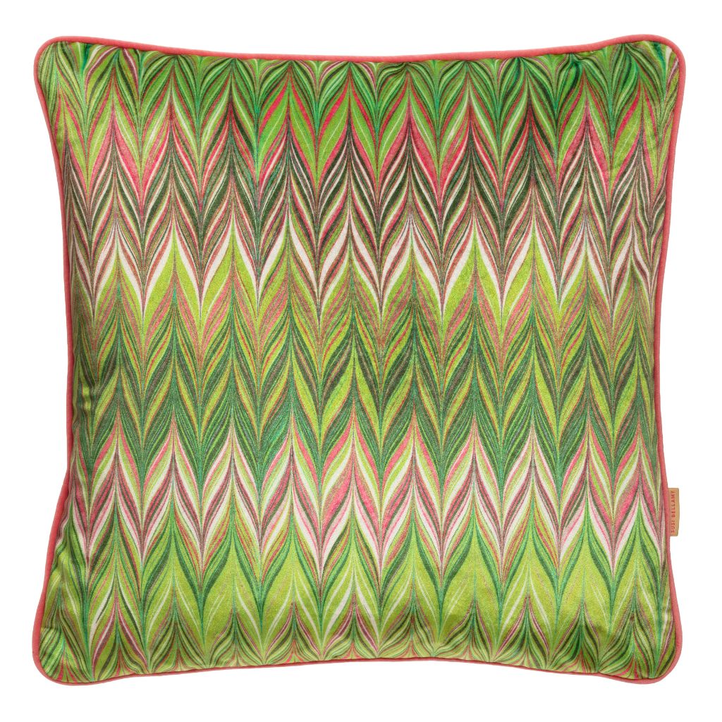 A square decorative throw pillow featuring a vibrant green, pink, and beige zigzag pattern with a solid coral pink piped edge.