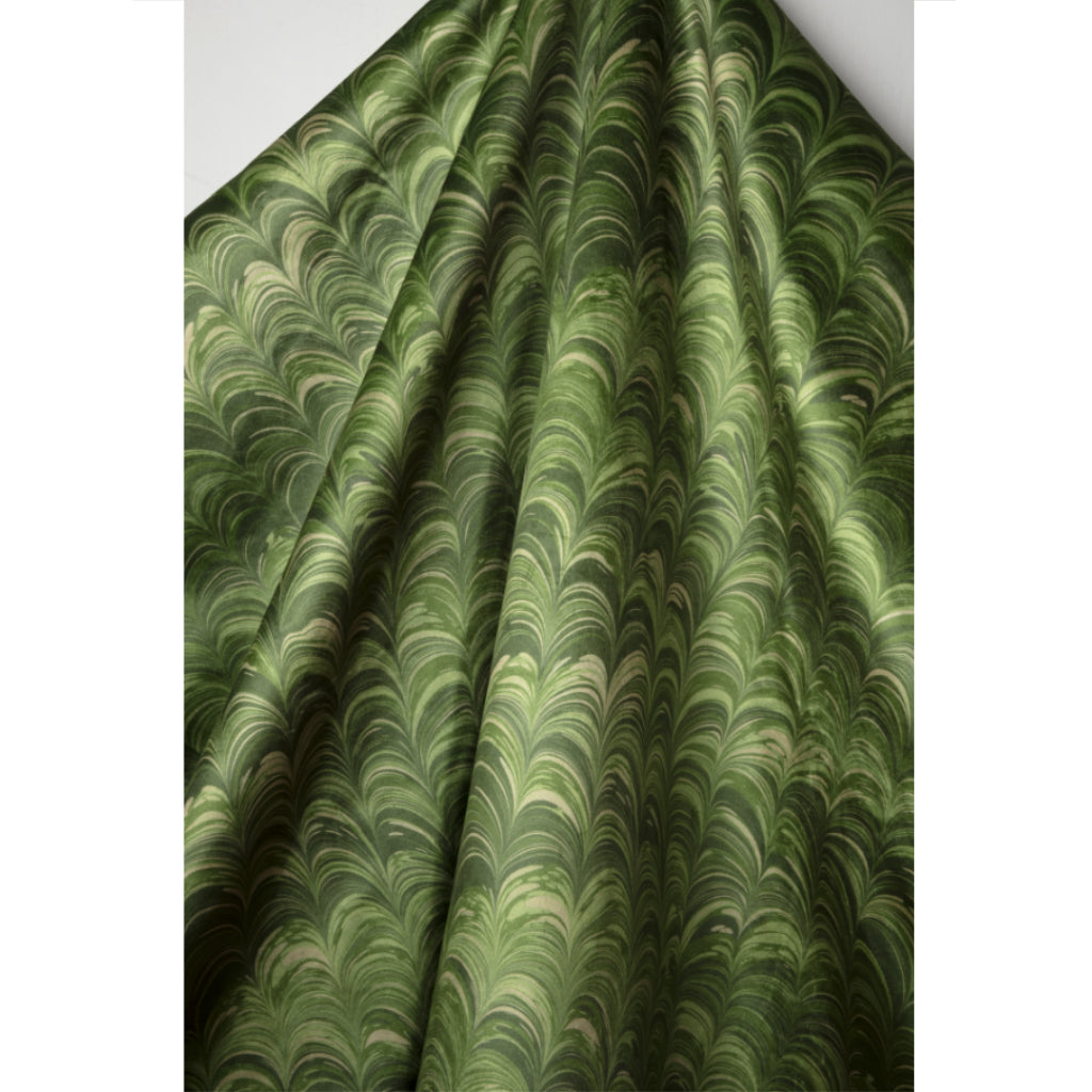 Green marbled velvet fabric on a white background