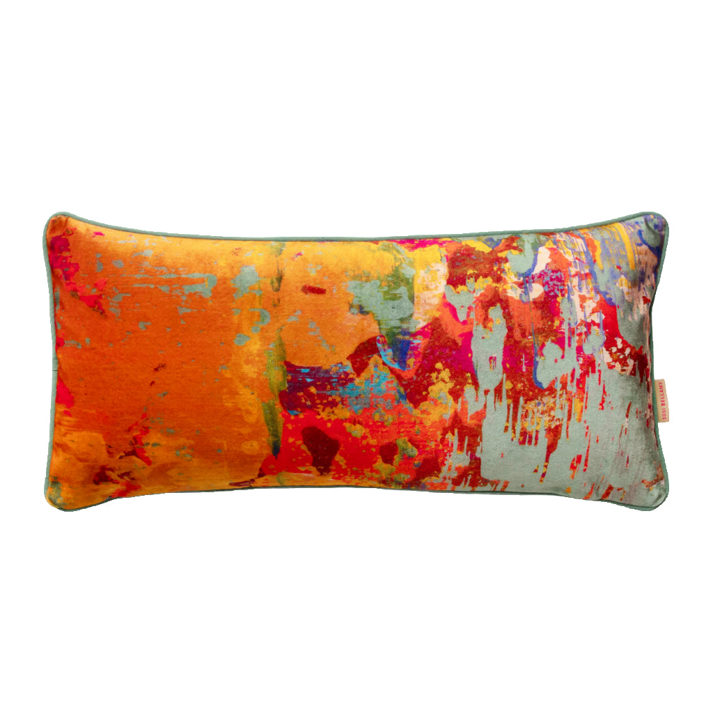 Colorful abstract-patterned pillow on a white background