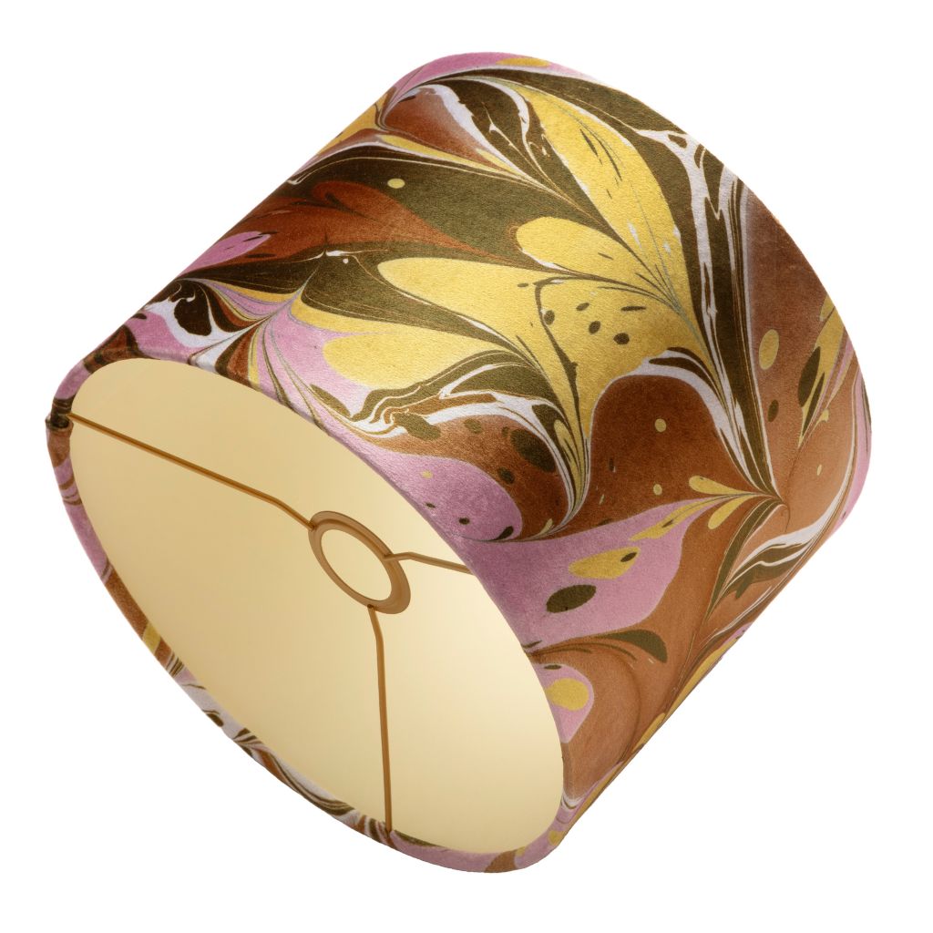 A drum lampshade with a marbled pattern in brown, yellow, pink, and white, shown on a plain white background