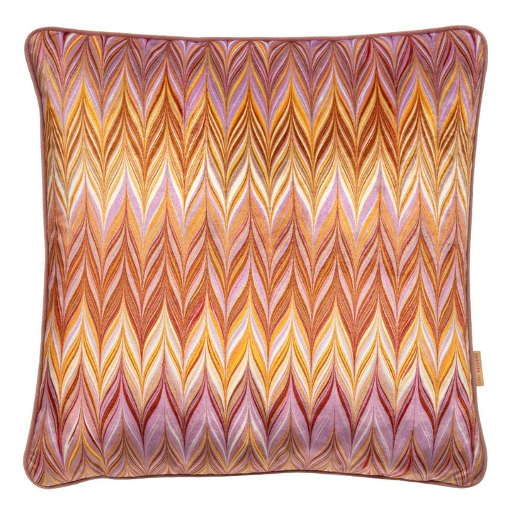 A square decorative throw pillow featuring a vibrant, multicolored chevron pattern with shades of orange, yellow, pink, and purple on a white background.