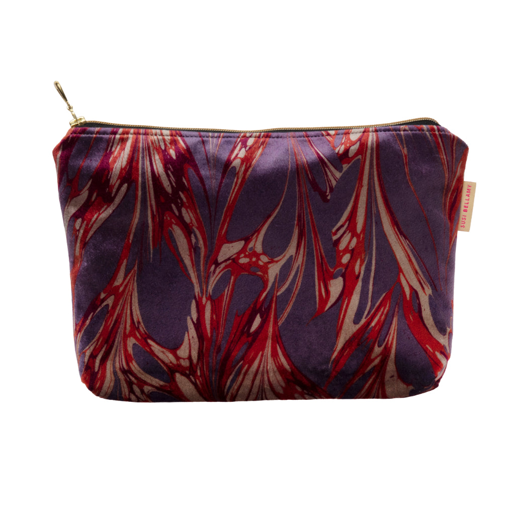 Pink, Red and Purple velvet pouch on a white background