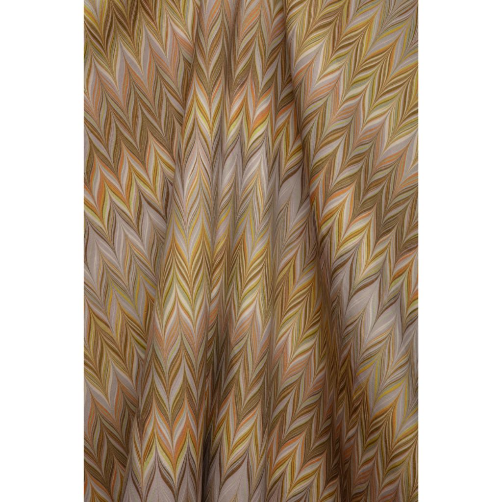 A close-up of a Missoni chevron pattern fabric featuring a zigzag herringbone design in shades of brown, beige, yellow and grey