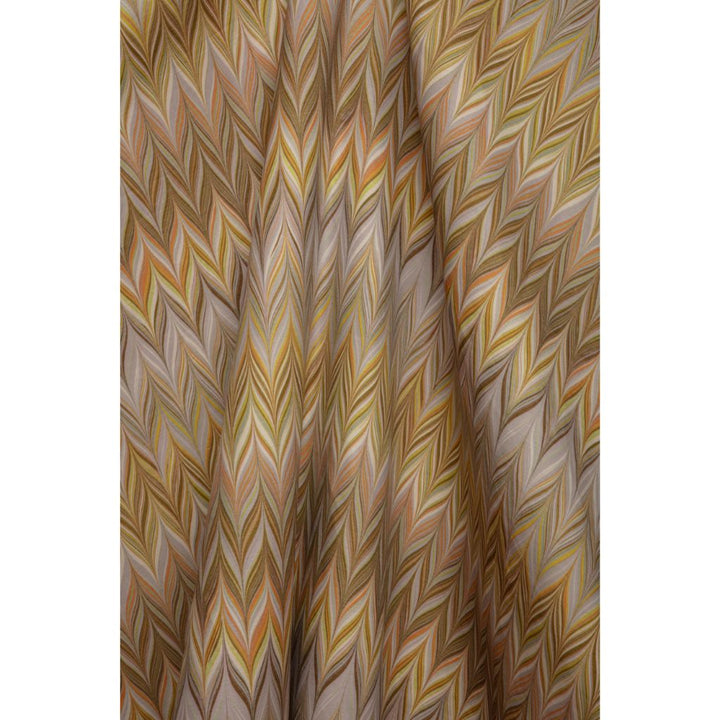 A close-up of a Missoni chevron pattern fabric featuring a zigzag herringbone design in shades of brown, beige, yellow and grey
