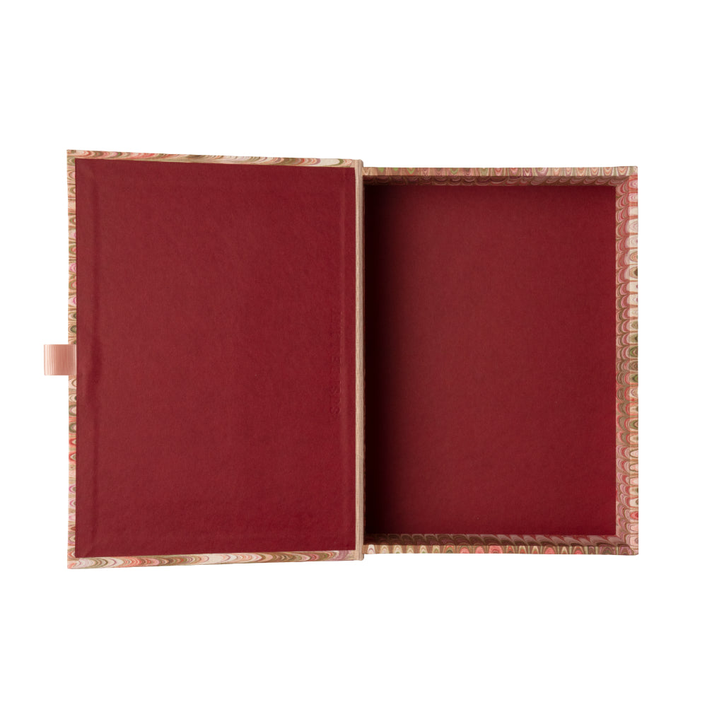 Marbled patterned pink box file on a white background