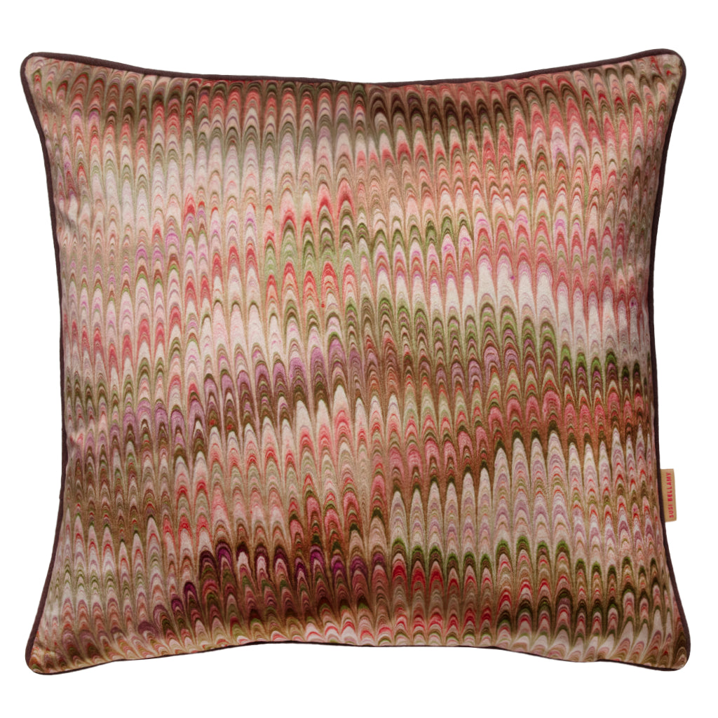 Decorative pillow with a multicoloured marbled pattern on a white background