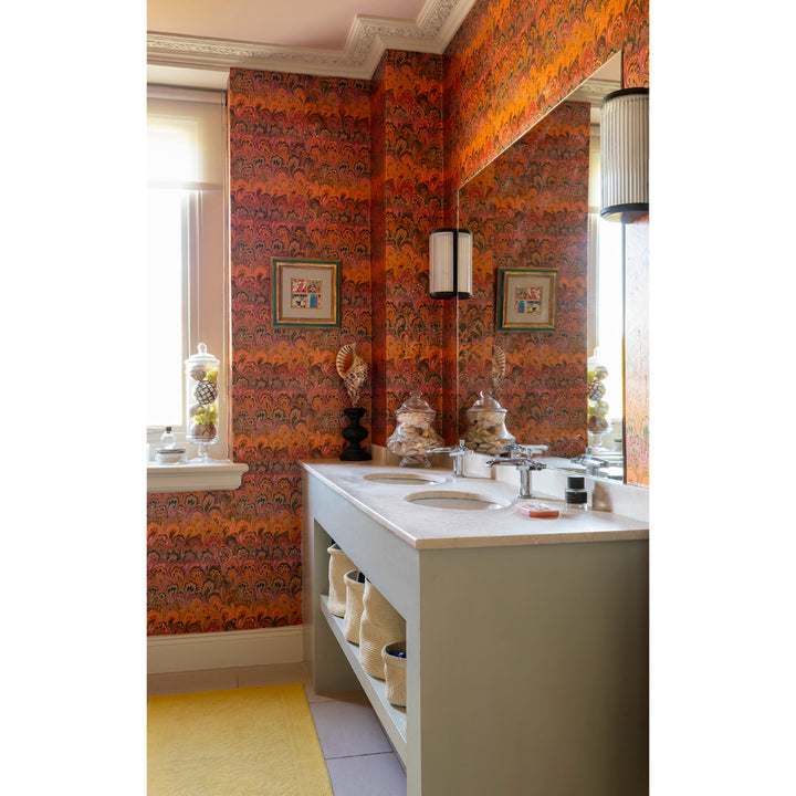 Bathroom with patterned wallpaper on wall and a white vanity, and decorative elements.