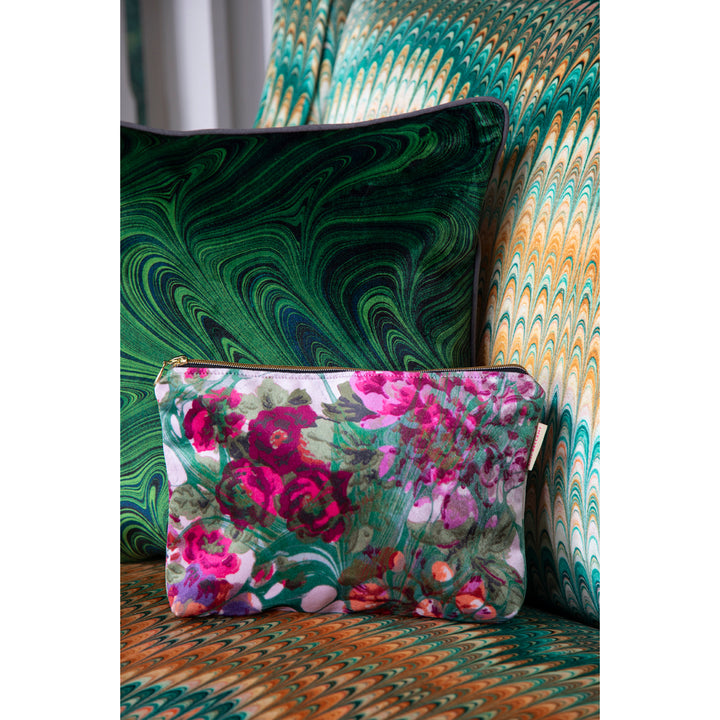 Floral velvet pouch on a patterned surface