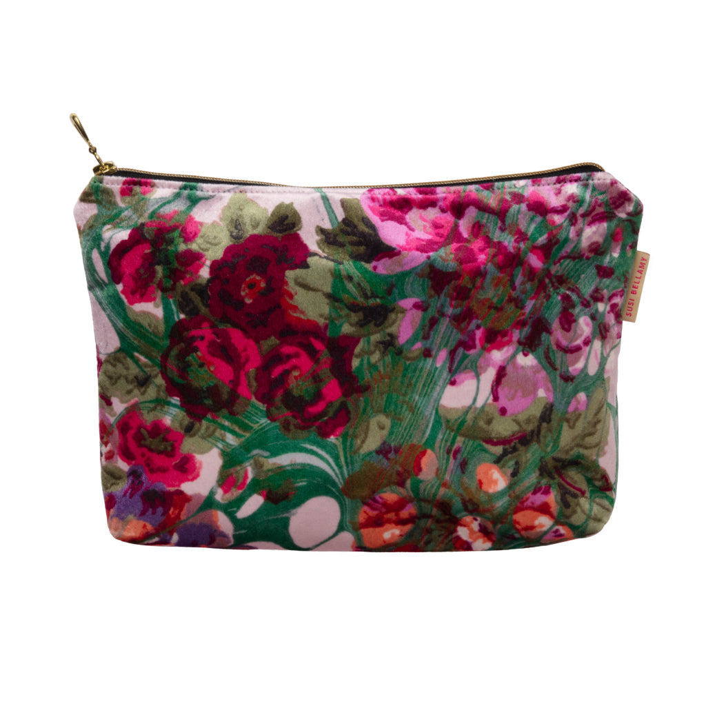 Floral patterned velvet pouch on a white background