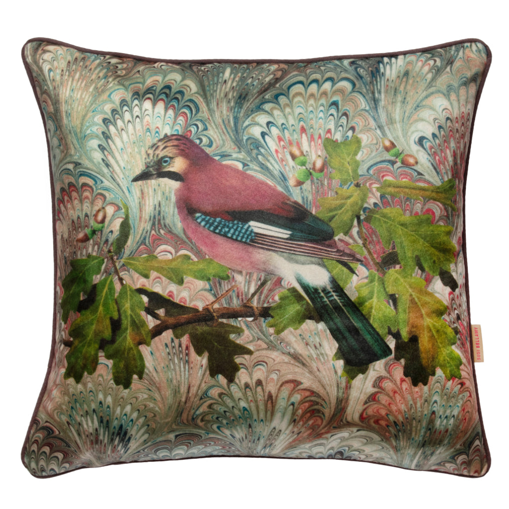 Decorative pillow with a bird and leaf design on a colorful background