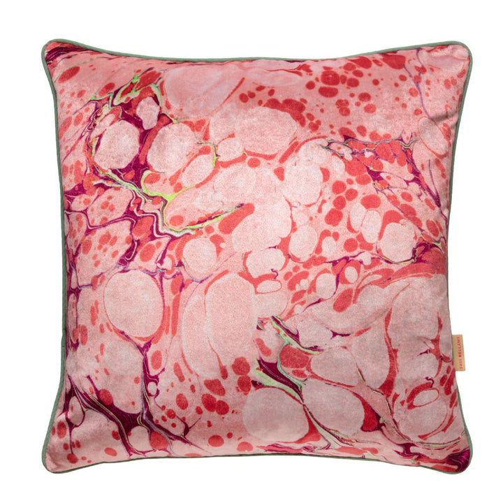 A square decorative throw pillow featuring a pink marbleised pattern with dark purple veins and a muted sage green border, shown against a plain white background.