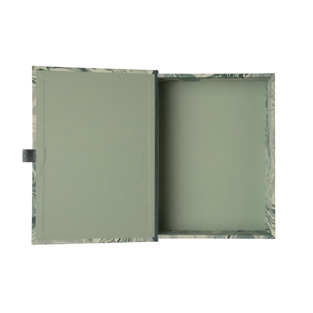 Marble-patterned blue and grey box file on a white background