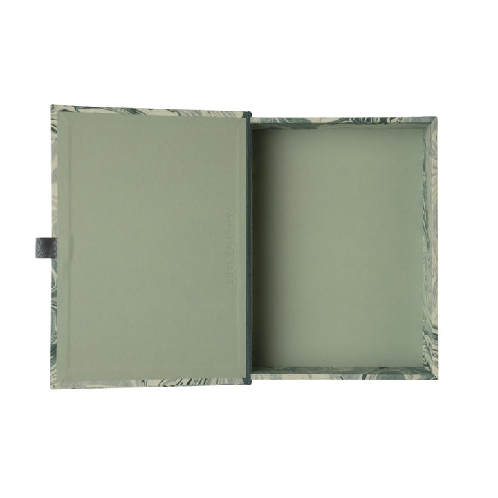 Marble-patterned blue and grey box file on a white background