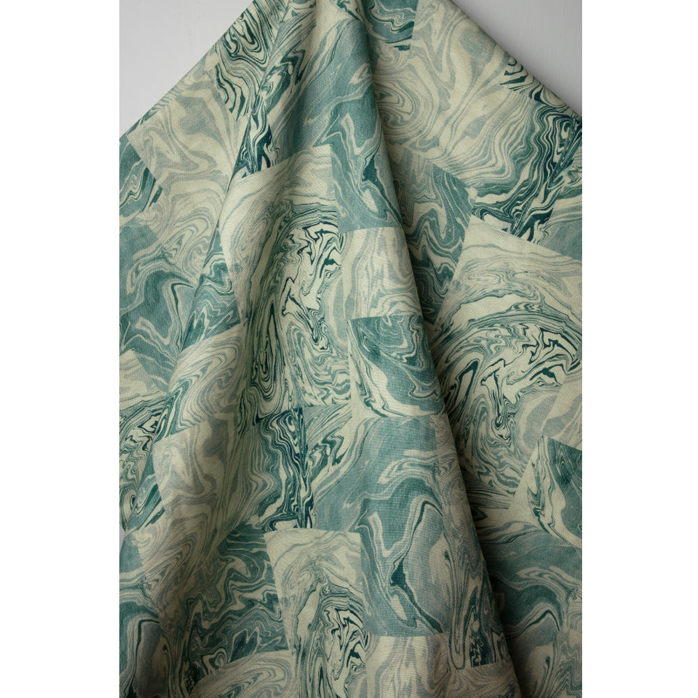 Patterned linen fabric with swirling design in shades of blue and white