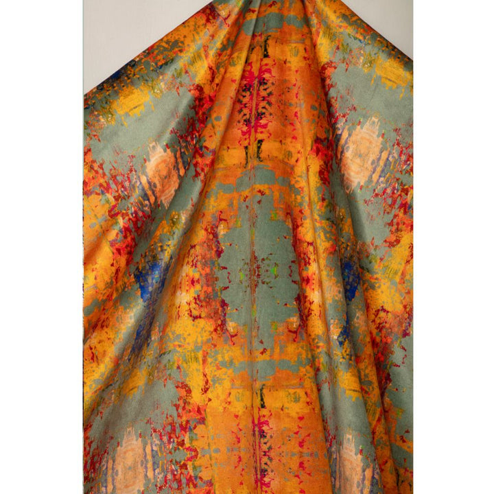 A draped piece of fabric with an abstract painterly pattern in orange, yellow, teal, red, and blue, shown against a plain light gray background.