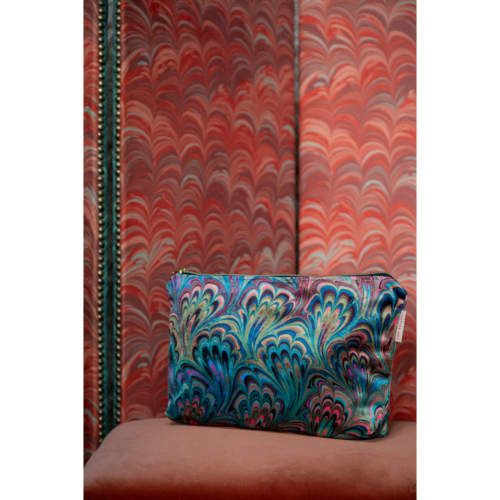 Colourful patterned pouch with a marbled wall in the background