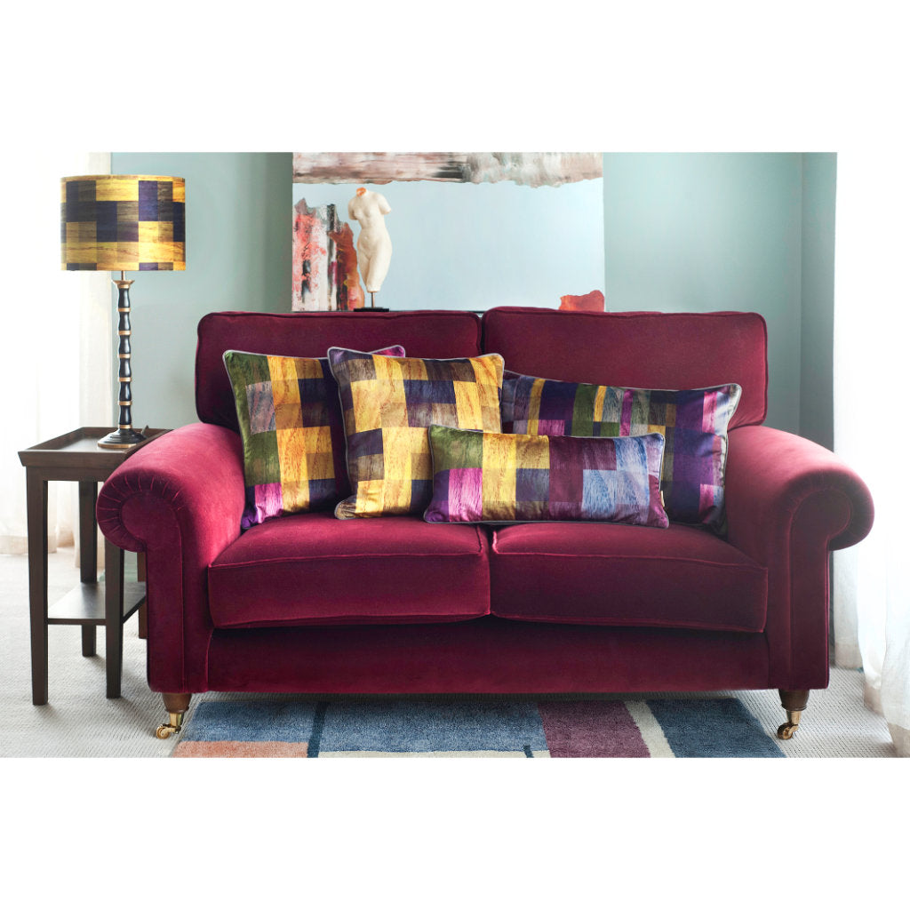 velvet pillow on velvet sofa